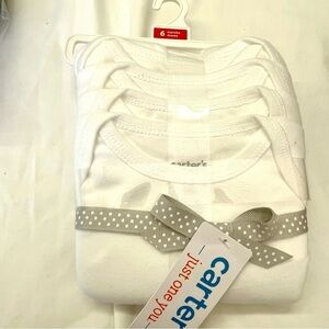 4 pack short sleeve onesie in white by Carters.
